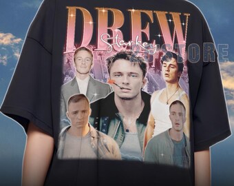 May include: Black unisex t-shirt featuring a collage of images and the name "DREW" in a vintage style. The shirt includes the text "Starkey Store". The shirt is an XL size.