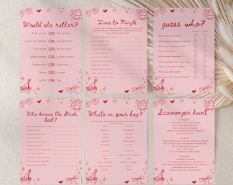 May include: Pink bridal shower game cards with red text and illustrations. The cards include games like "Would She Rather?" and "Guess Who?" with decorative hearts, bows, and champagne bottles.