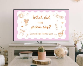 May include: A flat-screen TV displays a pink-bordered graphic with the text "What did the groom say?" and "Olivia's Hen Party Quiz." The design includes illustrations of a disco ball, champagne glasses, and sunglasses. The TV sits on a light gray console.
