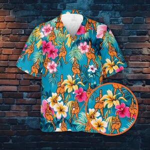 May include: A blue Hawaiian shirt with a tropical print featuring orange figures giving the middle finger. The shirt has a button-up front and short sleeves.