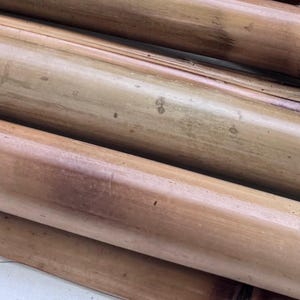 Set of Four (2&quot;-2.5” diam) Fire Cured Bamboo Poles.