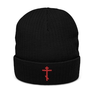 May include: Black knitted beanie with a red embroidered Orthodox cross.