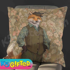 May include: Square decorative pillow featuring a dapper fox illustration. The fox is dressed in a vest, shirt, and hat, set against a floral patterned background. The pillow has a vintage aesthetic and is likely used for home decor.