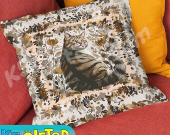 May include: A square throw pillow featuring a central illustration of a brown tabby cat surrounded by a border of stylized flowers and leaves in shades of brown, beige, and white. The cat is depicted in profile looking to the right.