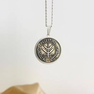 This piece represents the 1927 50 Mil coin. (one-sided coin).
Handmade in Palestine of high quality sterling silver.
