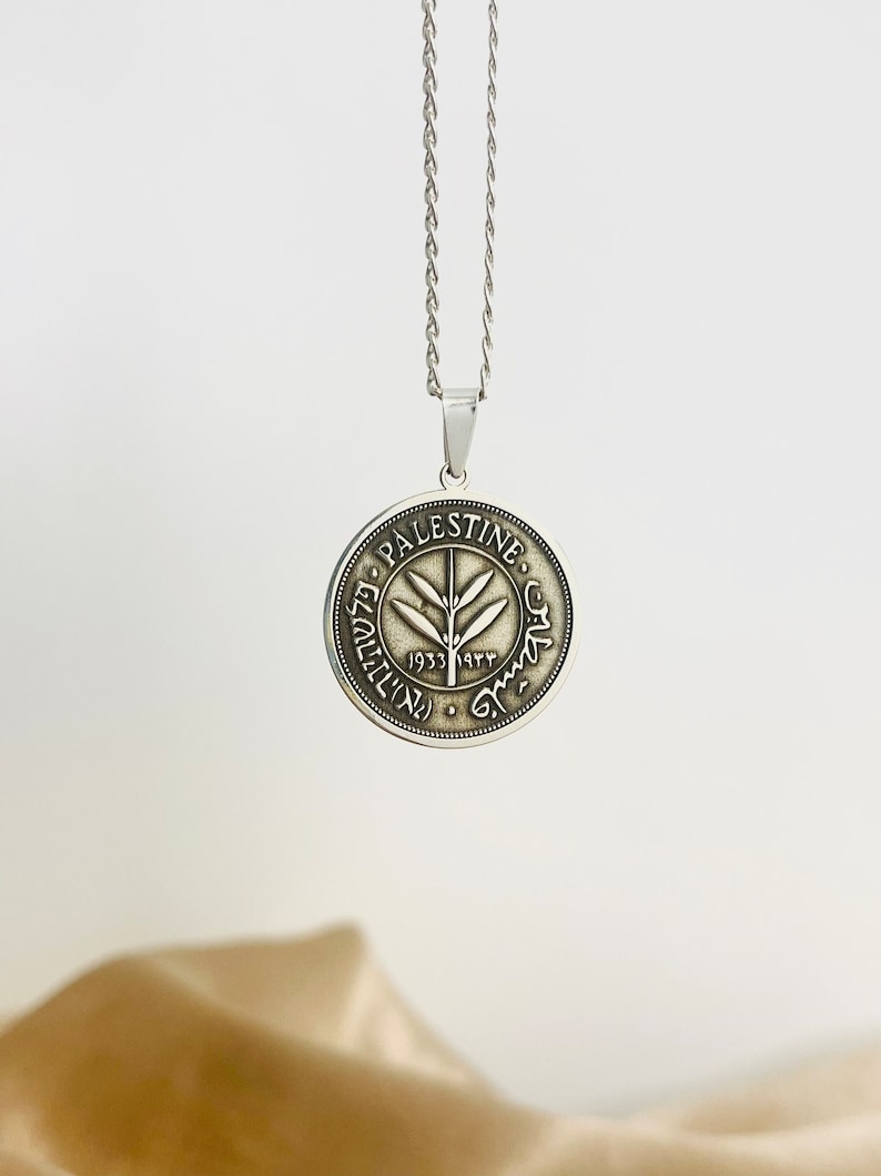 This piece represents the 1927 50 Mil coin. (one-sided coin).
Handmade in Palestine of high quality sterling silver.