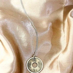 This piece represents the 1927 10 or 5 Mil coin. (Double-sided coin). Can be worn on both sides!
Handmade in Palestine of high quality sterling silver.