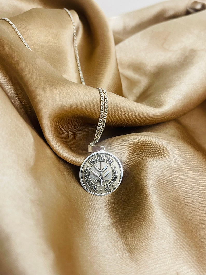 This piece represents the 1927 50 Mil coin. (one-sided coin).
Handmade in Palestine of high quality sterling silver.