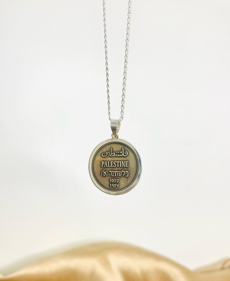 This piece represents the 1927 2 Mil coin. (Double-sided coin). Can be worn on both sides!
Handmade in Palestine of high quality sterling silver.