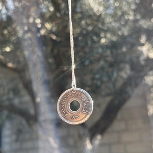 This piece represents the 1927 10 or 5 Mil coin. (Double-sided coin). Can be worn on both sides!
Handmade in Palestine of high quality sterling silver.