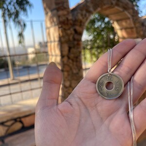 This piece represents the 1927 10 or 5 Mil coin. (Double-sided coin). Can be worn on both sides!
Handmade in Palestine of high quality sterling silver.