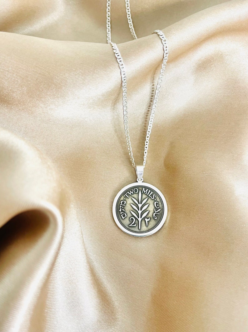 This piece represents the 1927 2 Mil coin. (Double-sided coin). Can be worn on both sides!
Handmade in Palestine of high quality sterling silver.