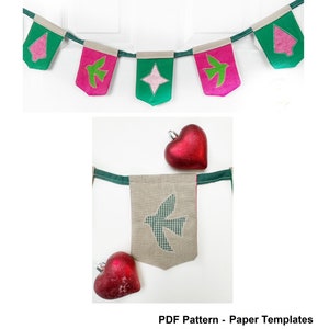 May include: A PDF pattern for a mini hanging banner with a Christmas theme. The banner features a green tree, a peace bird, and a star. The pattern includes paper templates for each design.