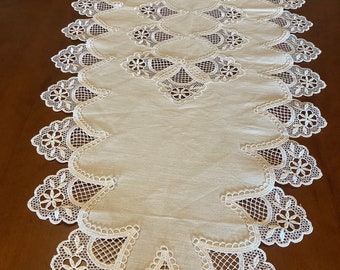 Linen table runner with lace appliqué