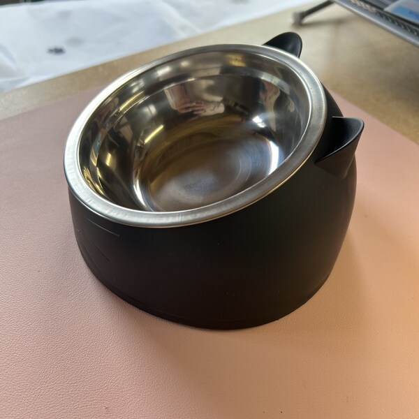 Black Raised cat bowl embossed with kitty face. Stainless steel inner.