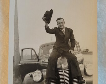Vintage 1940's Man Sitting on a Car