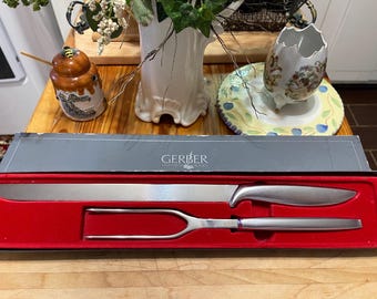 Vintage 1970’s GERBER Legendary Blade Carving Set of Two with original box.Looks new.Knife 15” and Fork 11”.High quality stainless steel.