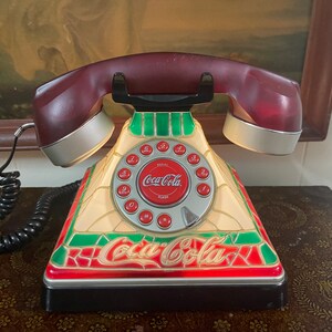 Vintage Coca-Cola Retro Stained Glass Style push button working telephone.6 3/4 square and 6 1/2 tall.Made in USA.Free shipping.