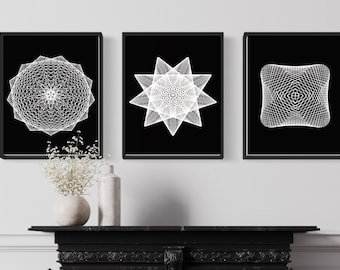 May include: Three black framed prints with white geometric designs. The designs are a circle, a star, and a square.