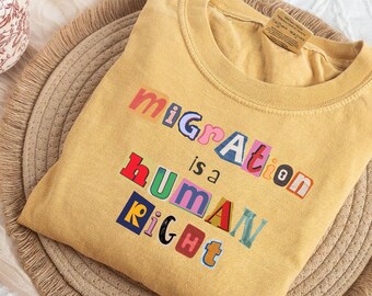 Trendy Immigrant Rights Shirt, Magazine Letters Social Justice T-shirt, Retro Cultural Protest Tee, Migration is a Human Right Activist Gift