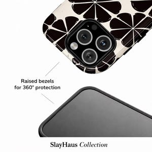 Puede incluir: Primer plano de una funda de tel&eacute;fono con un dise&ntilde;o de fruta c&iacute;trica en blanco y negro. La funda tiene un borde negro y biseles elevados para una protecci&oacute;n de 360&deg;. El texto "SlayHaus Collection" es visible.