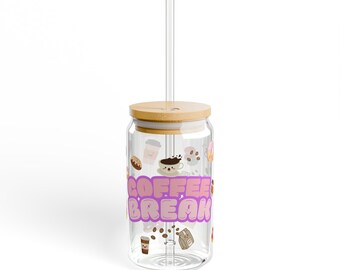 May include: A clear glass tumbler with a bamboo lid and a clear straw. The glass features a repeating pattern of small coffee-themed illustrations and the text COFFEE BREAK in large, bold, light purple letters with a darker purple outline.