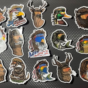 May include: A set of 15 stickers featuring various animals wearing sunglasses and a mohawk hairstyle. The animals include a bull, eagle, deer, duck, bison, llama, alligator, snake, fish, and bear. The stickers have a patriotic theme with American flag colors and the word "Merica" on some of them.