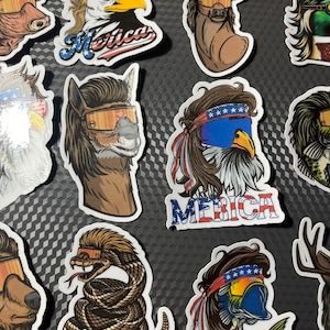 May include: A collection of 10 colorful stickers featuring various animals wearing patriotic bandanas and sunglasses. The animals include an eagle, a deer, a snake, a fish, an alpaca, a bull, and a duck. The stickers have a 'Merica' theme and are perfect for adding a touch of Americana to any surface.