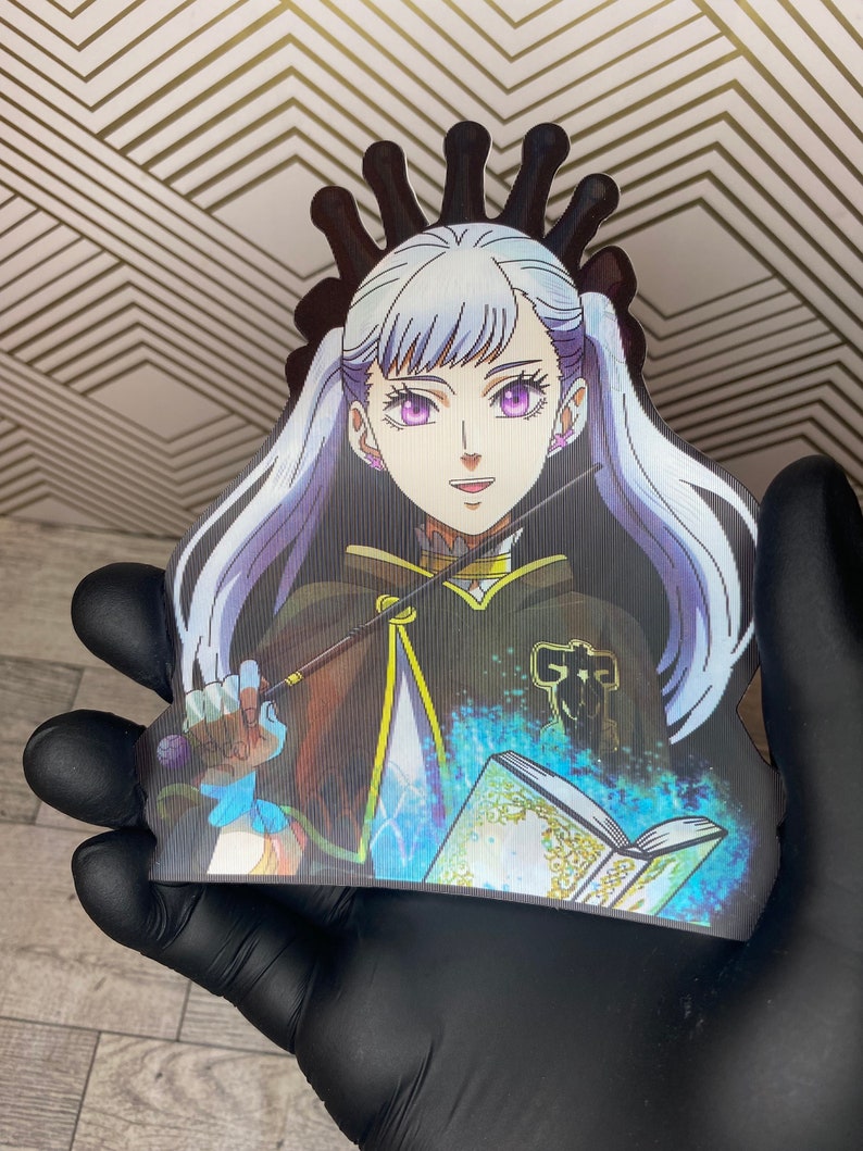May include: A white-haired anime character with purple eyes, wearing a black and gold robe, holding a staff and a book with blue magic swirling around it.
