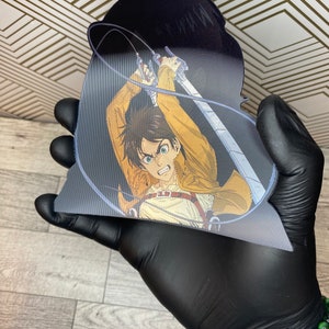 May include: A black and white anime character with brown hair and green eyes is holding two swords. The character is wearing a brown and tan outfit with a belt. The background is black.