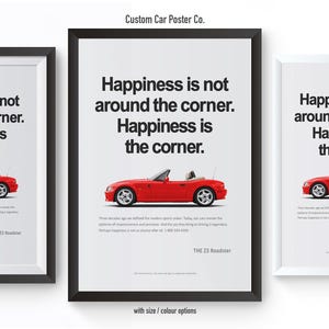 May include: Three framed posters with a red convertible car illustration. Each poster has the text "Happiness is not around the corner. Happiness is the corner." The posters are in black and white frames.