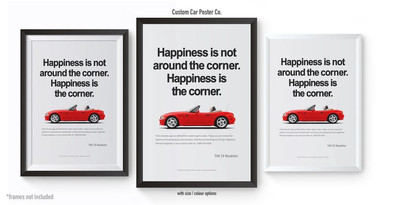 May include: Three framed posters with a red convertible car illustration. Each poster has the text "Happiness is not around the corner. Happiness is the corner." The posters are in black and white frames.