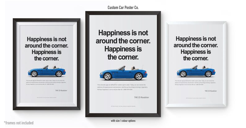 May include: Three framed posters with a blue convertible car illustration. Each poster has the text "Happiness is not around the corner. Happiness is the corner." The posters are in black and white frames.