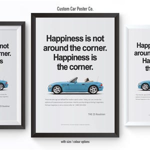 May include: Three framed posters with a light blue convertible car illustration. Each poster has the text "Happiness is not around the corner. Happiness is the corner." The posters are in black and white frames.