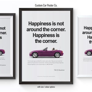 May include: Three framed posters with a white background and black text that reads "Happiness is not around the corner. Happiness is the corner." Each poster features a purple convertible car. The text "THE Z3 Roadster" is at the bottom.