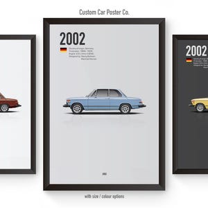 May include: Three framed posters featuring a vintage car, the BMW 2002, in three different colors: red, blue, and yellow. Each poster has the year "2002" and the German flag printed on it. The posters are set against a white background.