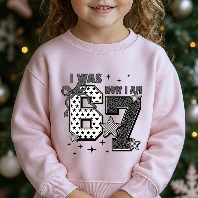 Detailed view of the texture and print quality of the "Turning Seven" shirt. The number 7 is filled with a stylish grey and black leopard/cheetah print, while the number 6 has a star pattern. A black bow illustration connects the theme. This design is available on t-shirts and sweatshirts, making it a versatile gift for a daughter or niece's seventh birthday celebration in any season.