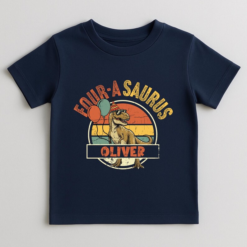 A mockup of the "Fourasaurus" design on a light beige toddler t-shirt. The personalization section at the bottom is highlighted with the name "OLIVER." The illustration includes green and orange balloons and a detailed T-Rex, signifying the big transition to being four years old. The fabric looks soft and comfortable for all-day birthday play.