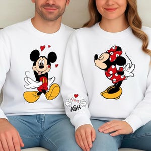 These couples tops are perfect for gifting or wearing together on special occasions. The cute character illustrations stand out on soft, durable fabric that feels great all day long. Whether you’re planning a trip, taking holiday photos, or simply want coordinated matching outfits, this set is the ideal choice. Customize the sleeve initials to make it personal.