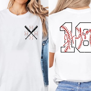 Front view of the pocket logo on a female model. The "MOM" text is customized in a collegiate block font with red stitching outlines. This minimalist front design allows the shirt to be worn casually while still showing support for the player.