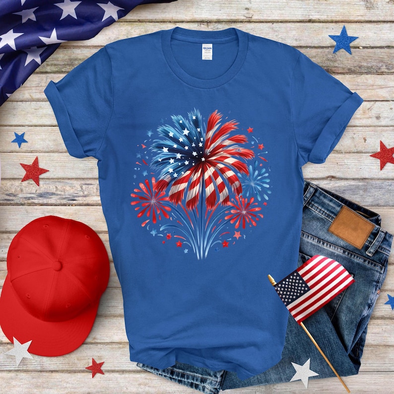 a blue t - shirt with a red, white, and blue fireworks on it