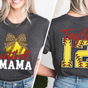 A flat lay image (implied) of the "Softball Spirit" collection. The double-sided design adds value. The back print mimics a real jersey but with the comfort of a soft cotton t-shirt or fleece sweatshirt.