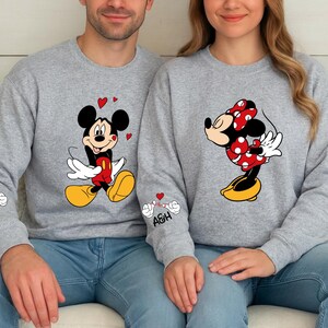 These charming couple designs are ideal for celebrating love with a playful twist. The tops are made from soft, cozy fabric and are available as shirts, hoodies, or sweatshirts. The artwork captures a sweet and romantic vibe, perfect for photos or gifting. Add personalized initials on the sleeve to create a unique couple’s outfit.