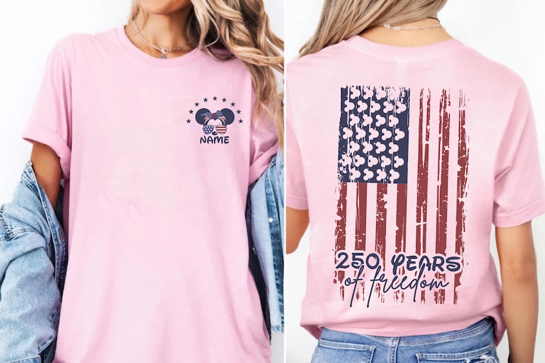 A woman wearing a pink t-shirt with an American flag design and the text "250 YEARS OF FREEDOM" printed on it.