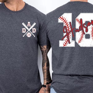 A shot highlighting the red script font. The name "Hudson" is written in a fluid, handwriting style that overlays the rigid block numbers, creating a modern and stylish aesthetic for sports parents.