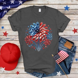 a t - shirt with an american flag and fireworks