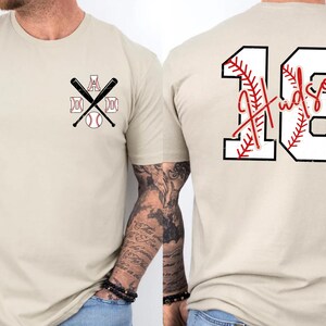 A flat lay image of the "Baseball Spirit" collection. The double-sided design adds value. The back print mimics a real jersey but with the comfort of a soft cotton t-shirt or fleece sweatshirt.