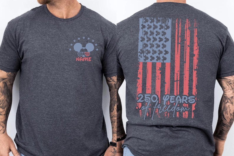 A gray t-shirt with a graphic design on the back, depicting an American flag and the text "250 PEARS OF FREEDOM" printed on it.