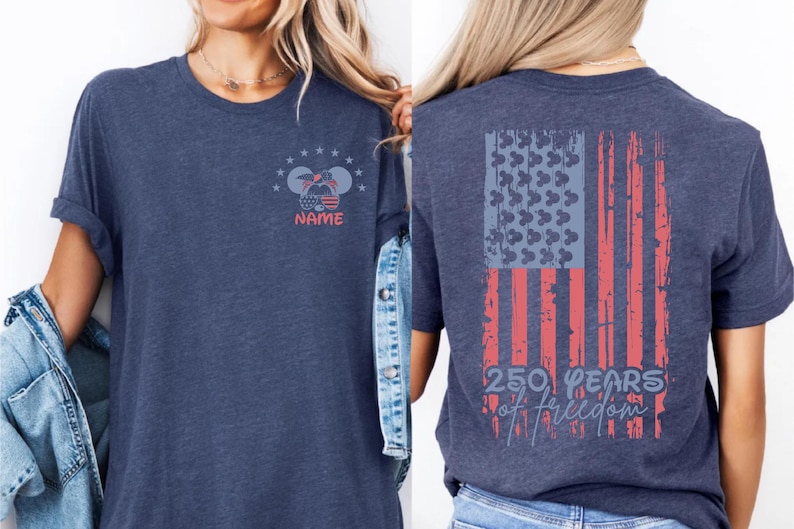 A woman wearing a blue t-shirt with a graphic design on the back, featuring an American flag and the text "250 YEARS OF FREEDOM".