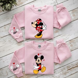 Designed for comfort and cuteness, this matching top set features high-quality artwork inspired by classic cartoon characters. Each piece is printed with care to ensure vibrant colors and crisp outlines. Available in multiple styles and sizes, the design is suitable for both casual and seasonal wear. Personalized initials make it even more meaningful for couples.